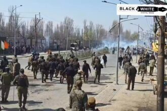 Police use tear gas shells to disperse people protesting the killing of Iran’s supreme leader, Ayatollah Ali Khamenei, in Srinagar.