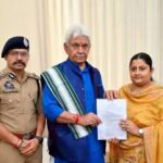 Hon'ble Lieutenant Governor Manoj Sinha hands over an appointment letter on compassionate grounds to Dr. Vaishali Misra, wife of late J&K Police Sub-Inspector Sachin Verma.